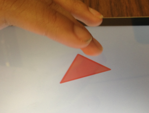 A person feeling a haptics enabled triangle.