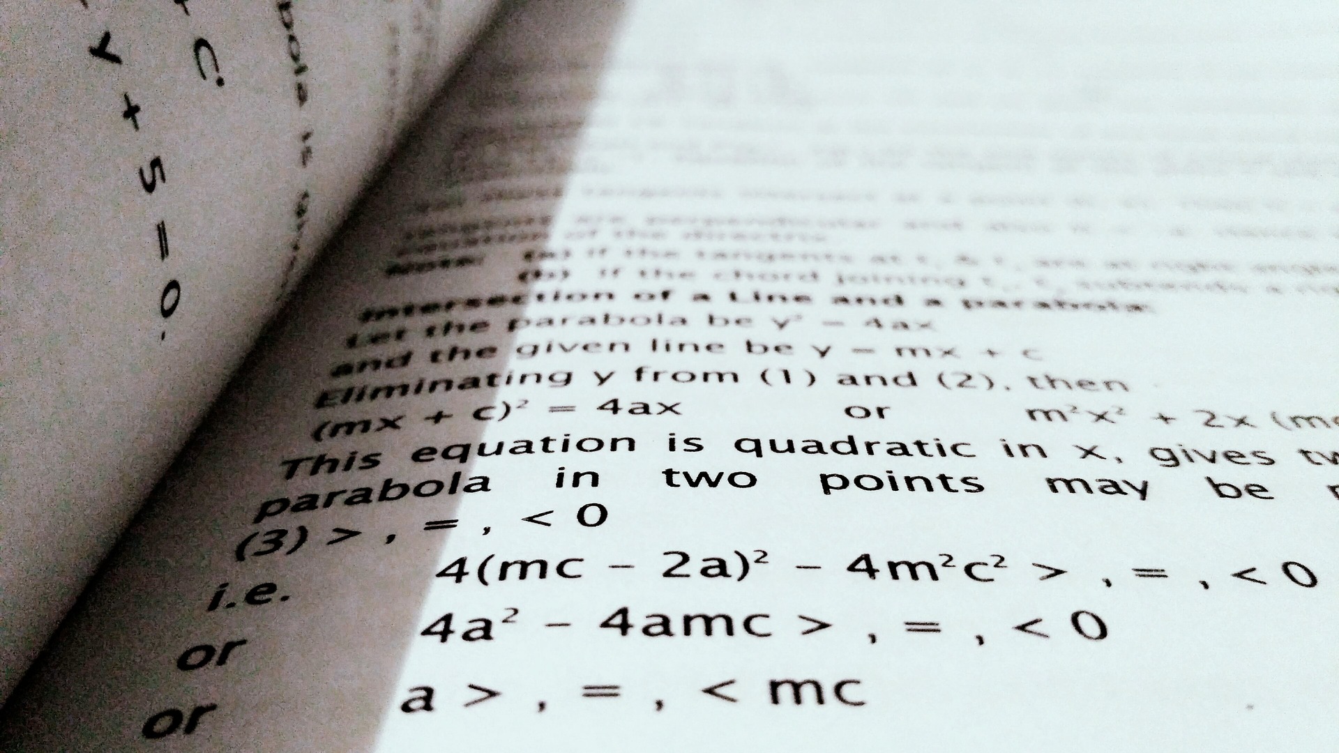 A photo of an open math textbook displaying part of a random algebra problem.